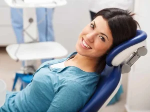 smiling woman during appointment dentists in Lincoln , NE